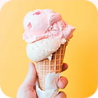 Pink ice cream in a big waffle cone