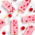 A few pink berry ice cream bricks on sticks