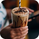 Ice coffee i a glass with cocktail tube